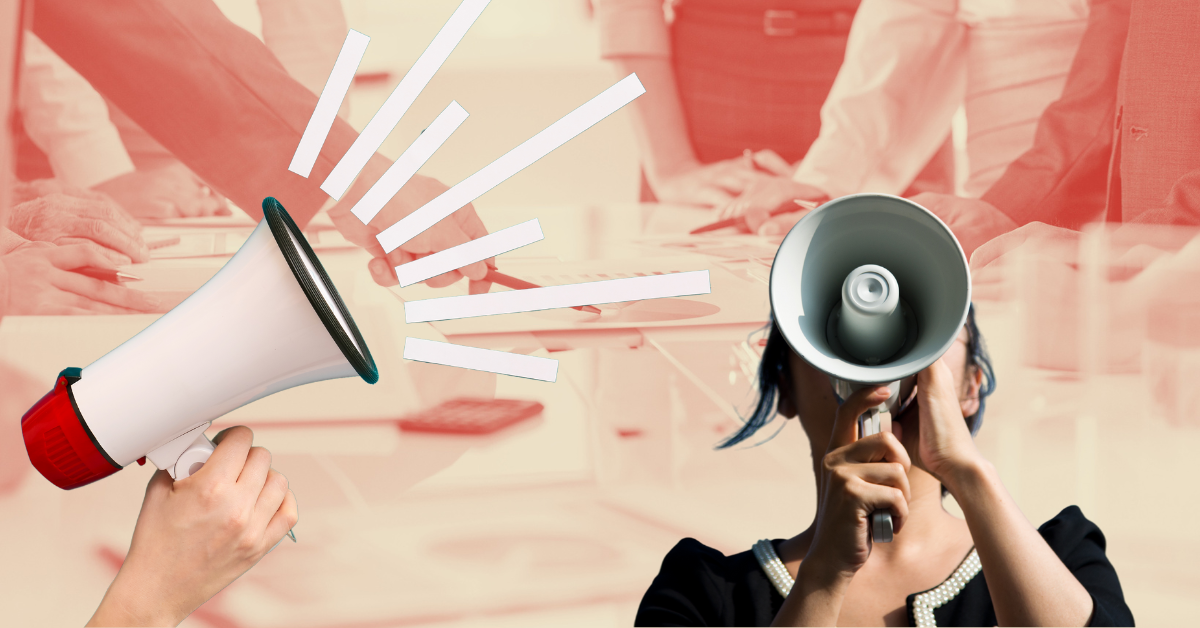 A woman in tech screaming into a megaphone against the backdrop of a meeting.