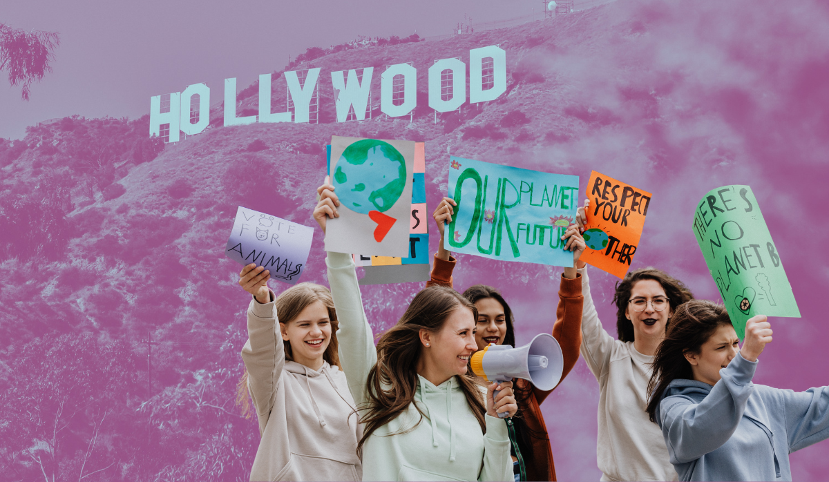 A group of teen girl activists stand in front of the hollywood sign. The vibe is millennial pink.